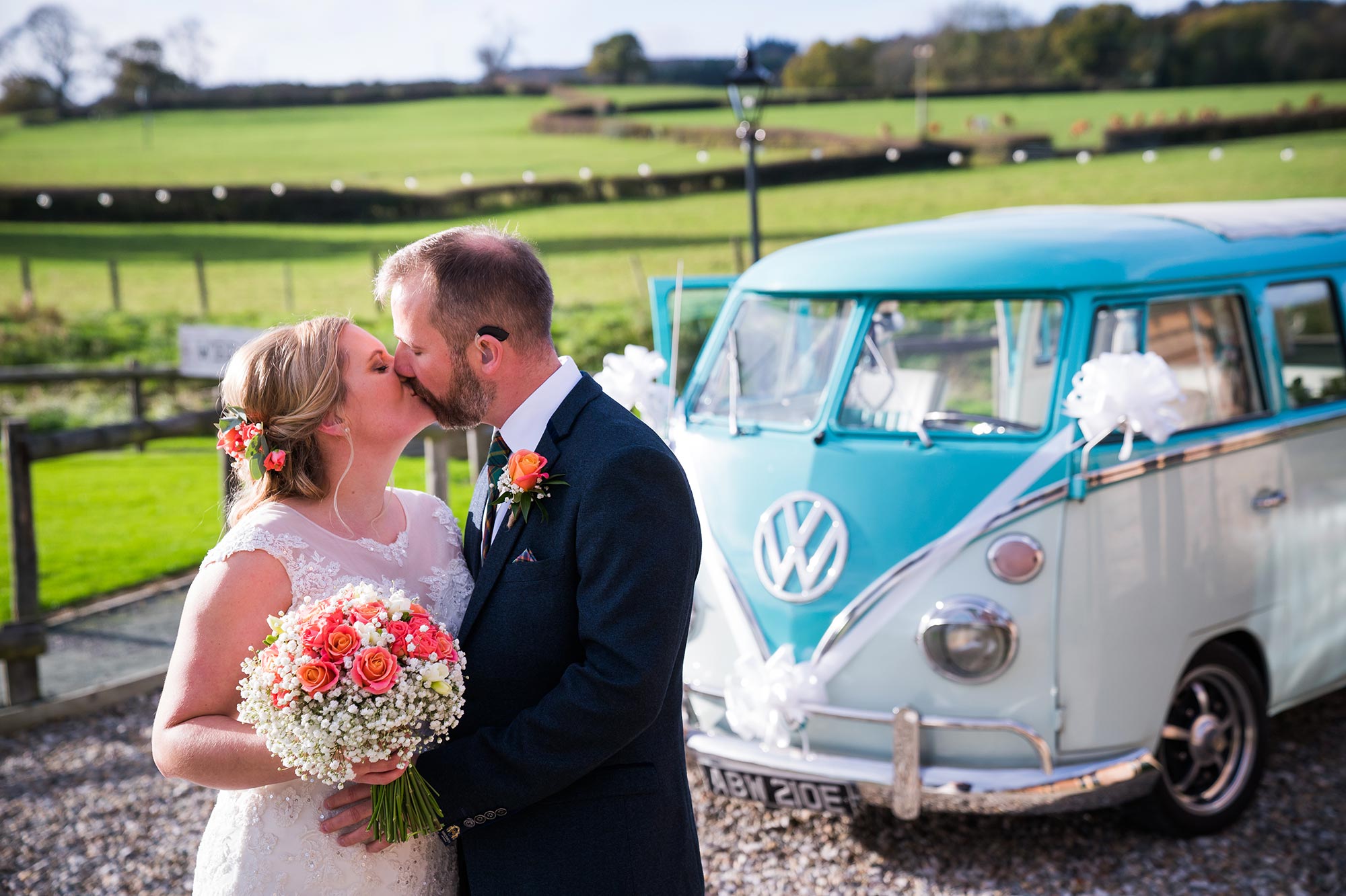 newlyweds Jane & Conor with their Split The Difference VW Campervan wedding car; Tower Hill Barns