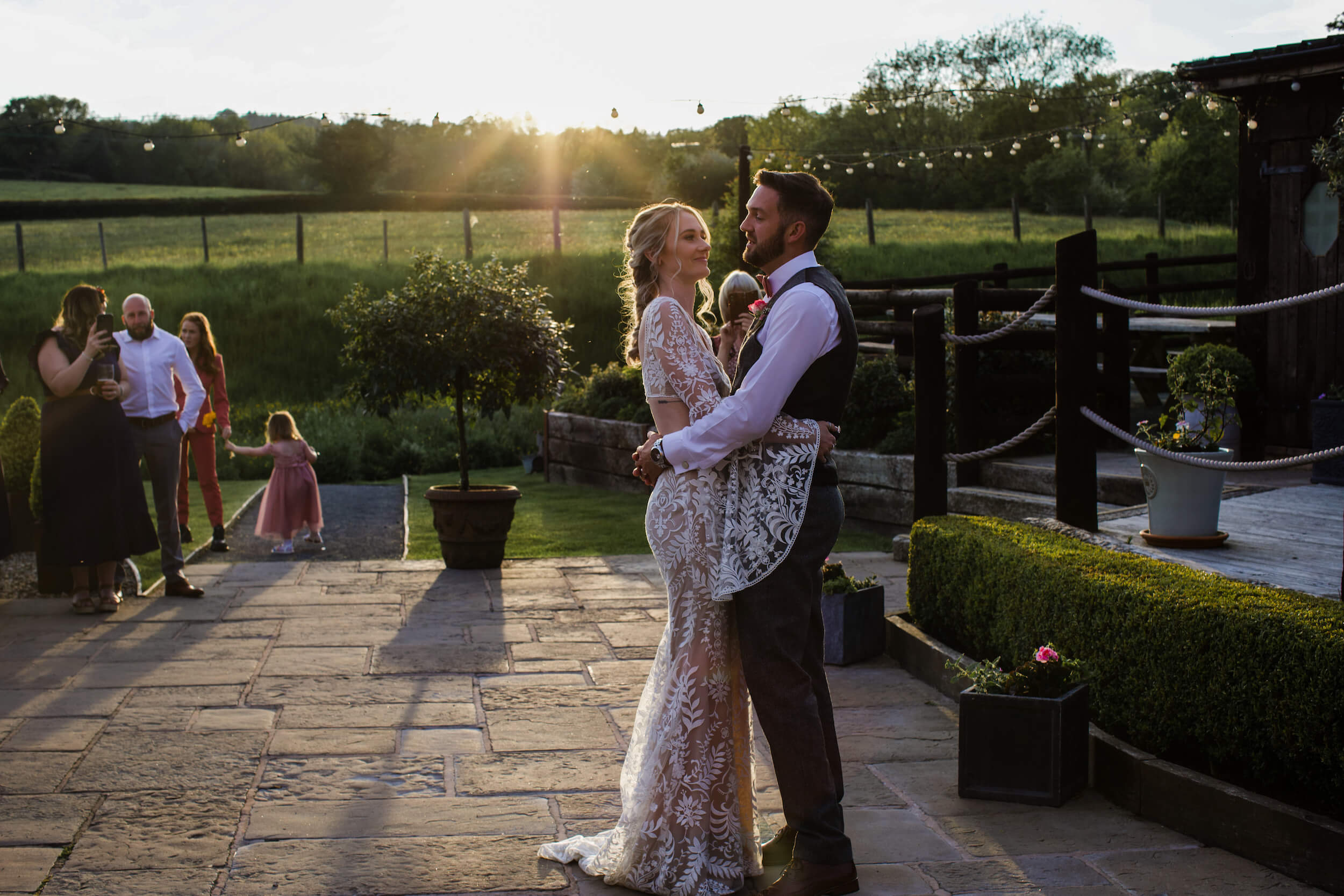 just married couple - wedding portraits - first dance on the terrace in golden hour at dusk - Sally Joanne photography