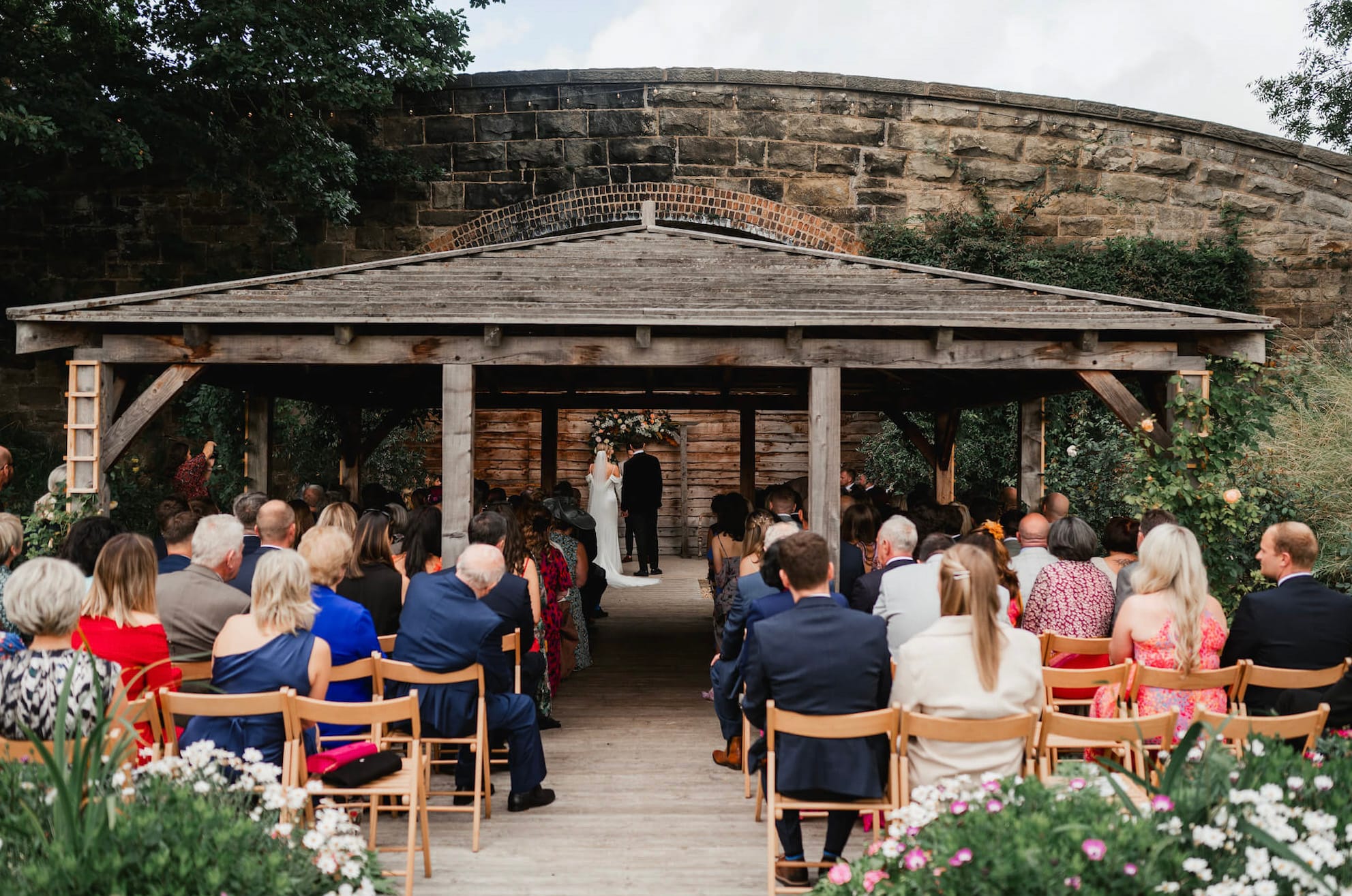 Newlyweds marry in a Civil Ceremony at Tower Hill Barns after following Tower Hill Barns - How To Book A Wrexham Registrar guide to book their officiant.