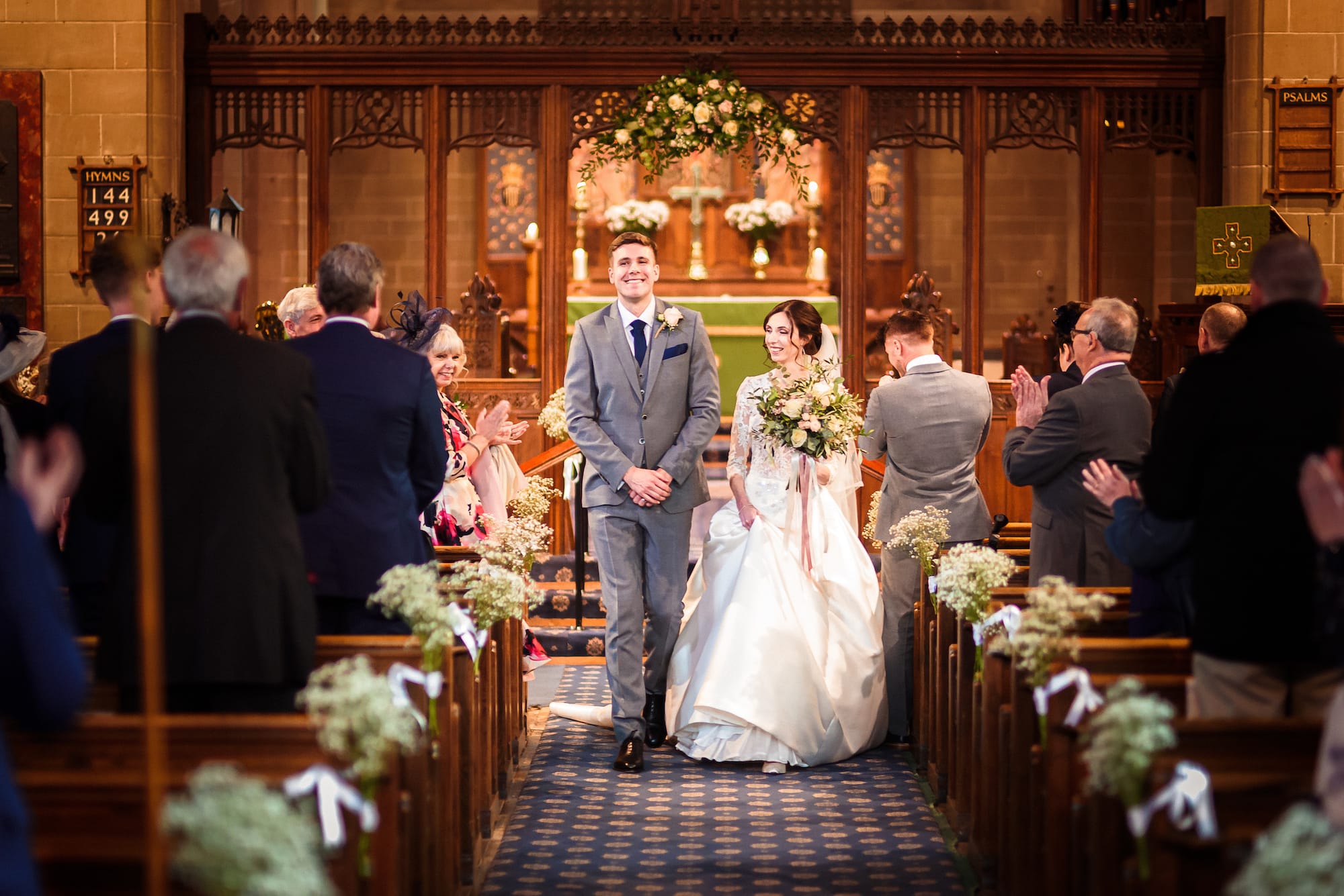 Bride and Groom exit following their church wedding, next stop Tower Hill Barns.