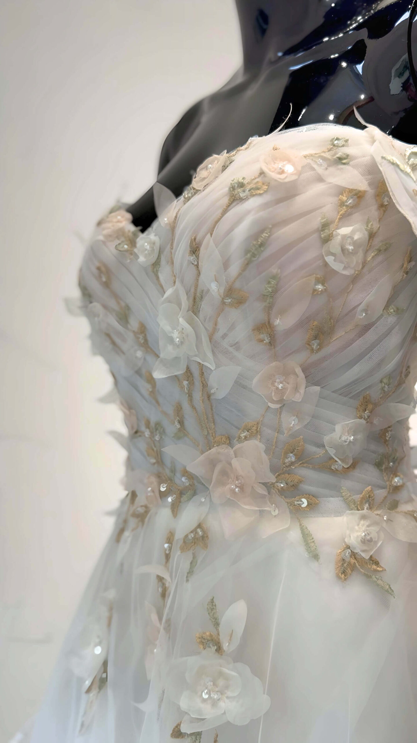 A close up of a beautiful flower petal dress sold by Shropshire Bridal Boutique 'The Dress Bridal Boutique' Oswestry.